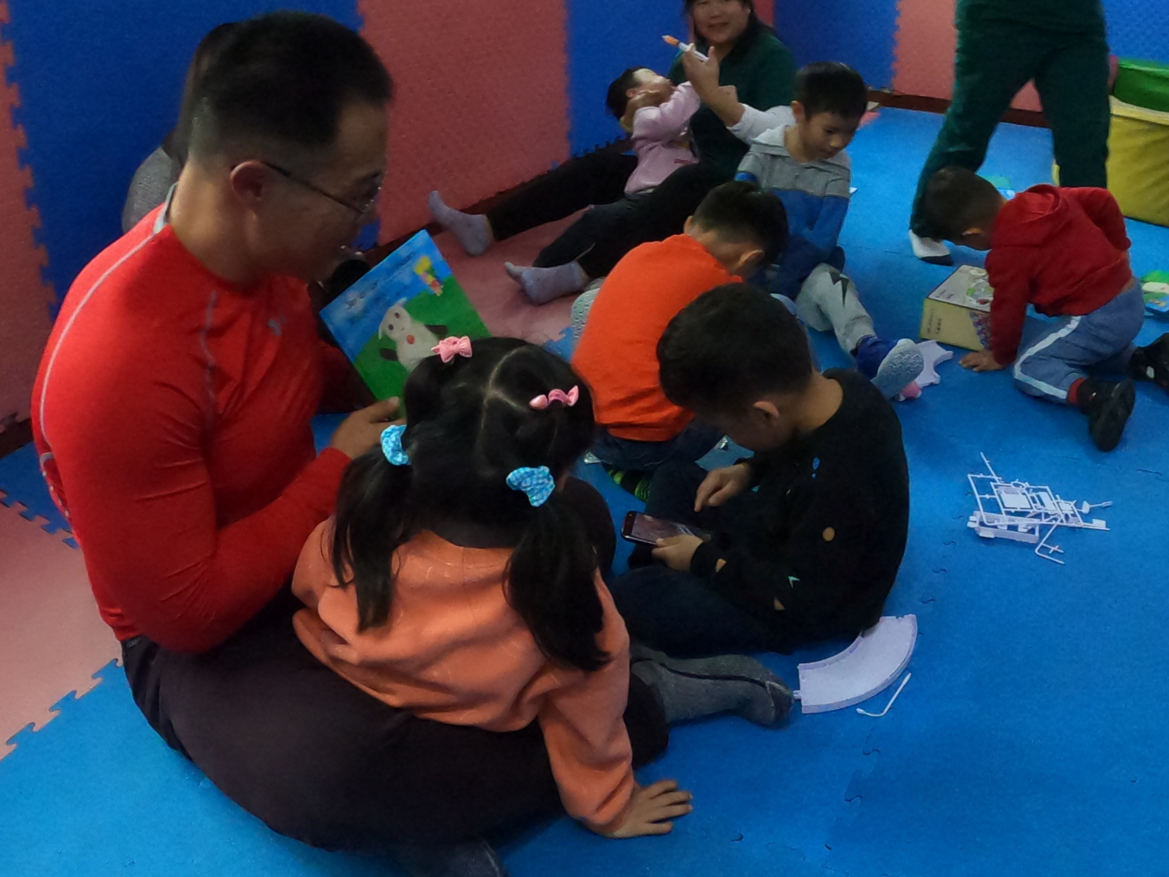 David Pat reading to children at orphan care center in Shanghai